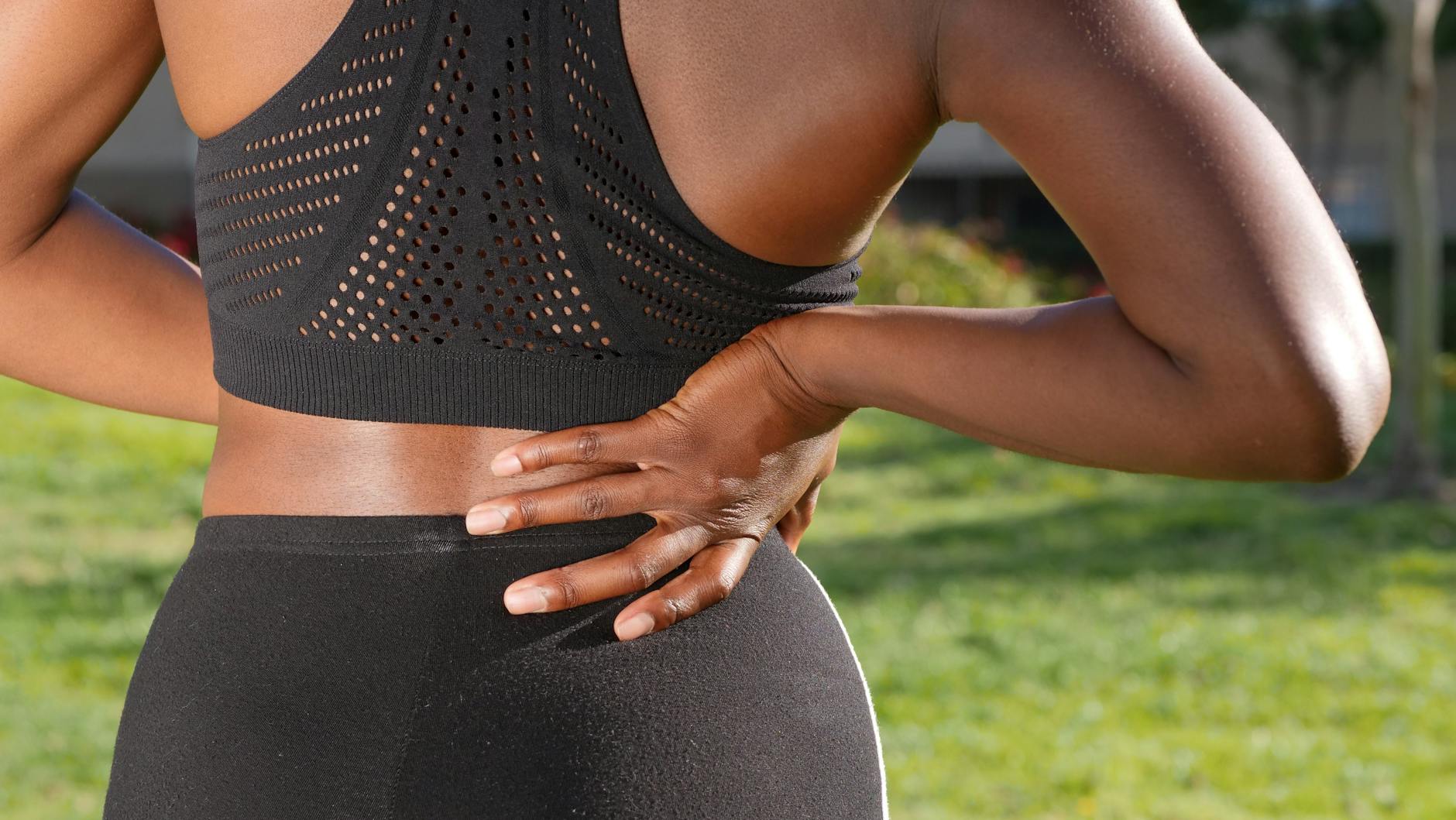 Person stretching to relieve back pain